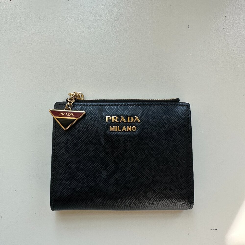 Prada black wallet with inner red lining